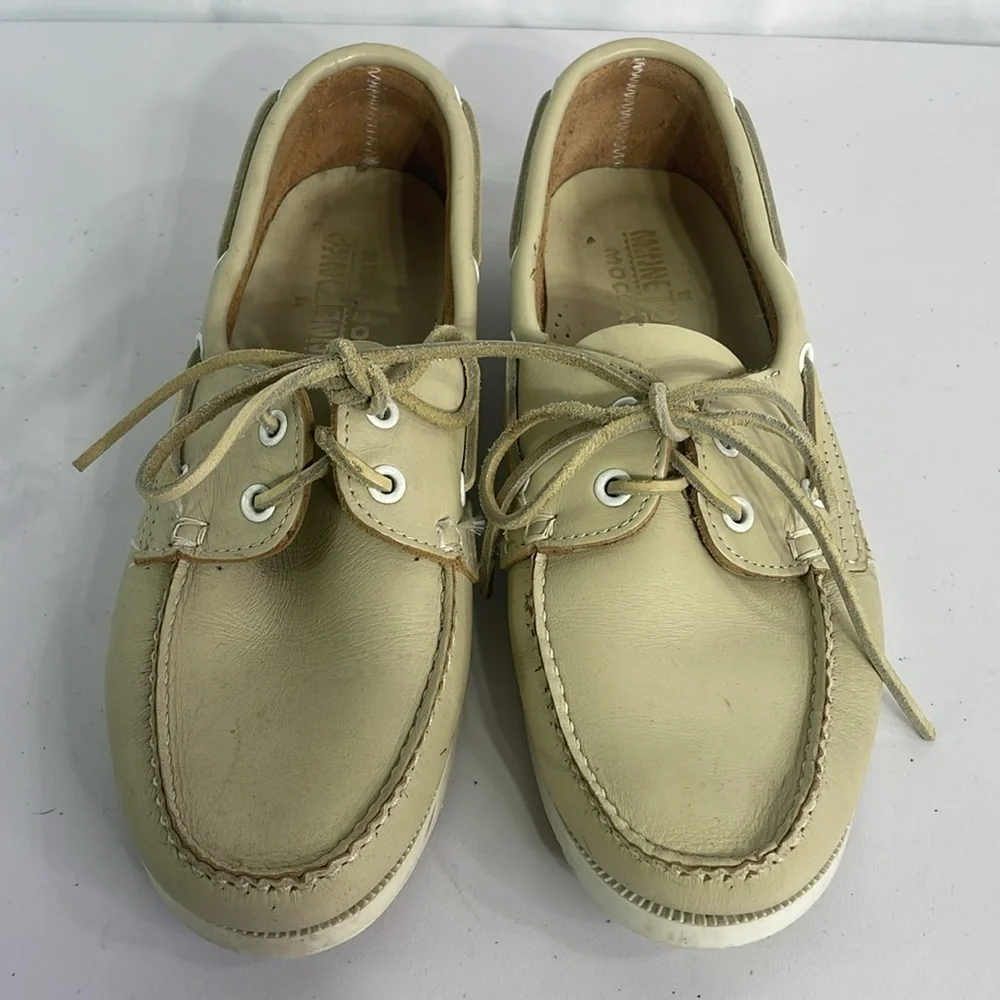 Minnetonka cream leather boat shoes, white sole